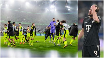 Dortmund players celebrate their victory over Wolfsburg, while Harry Kane of Bayern looks on (©Getty images)