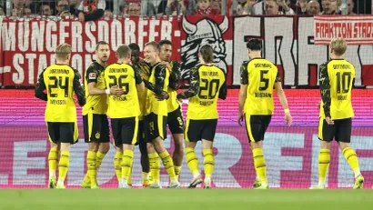 Dortmund players celebrating Guirassy's opener (©Christof Koepsel/Getty Images)