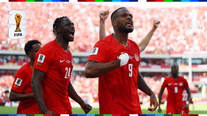 Larin celebrates ecstatically with his teammates (©REUTERS/Claudia Greco)