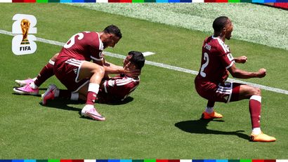 Qatar players ecstatically celebrate their late equalizer (©Fran Santiago/Getty Images)