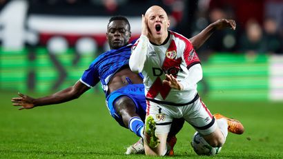 Timothy Ouma tackles Isi Palazon of Rayo Vallecano in the Conference League (© Alvaro Medranda/Quality Sport Images/Getty Images)