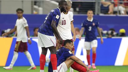 Saliba after picking up the back injury against Spain (©Lars Baron/Getty Images)