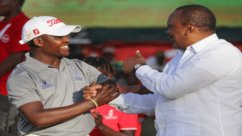 Simon Ngige is congratulated by President Uhuru Kenyatta during a past Kenya Open event: Photo Courtesy 