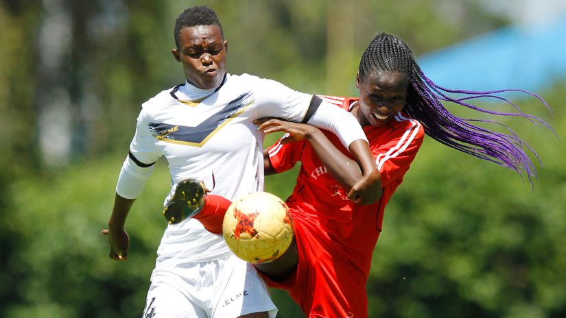 Ulinzi's Luck Mukhwana fights for the ball with Thika's Verenitah Mukoa