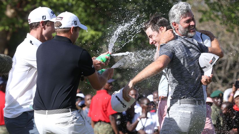 Guido Migliozzi (second right)celebrates with friends after winning the 2019 Magical Kenya Open 