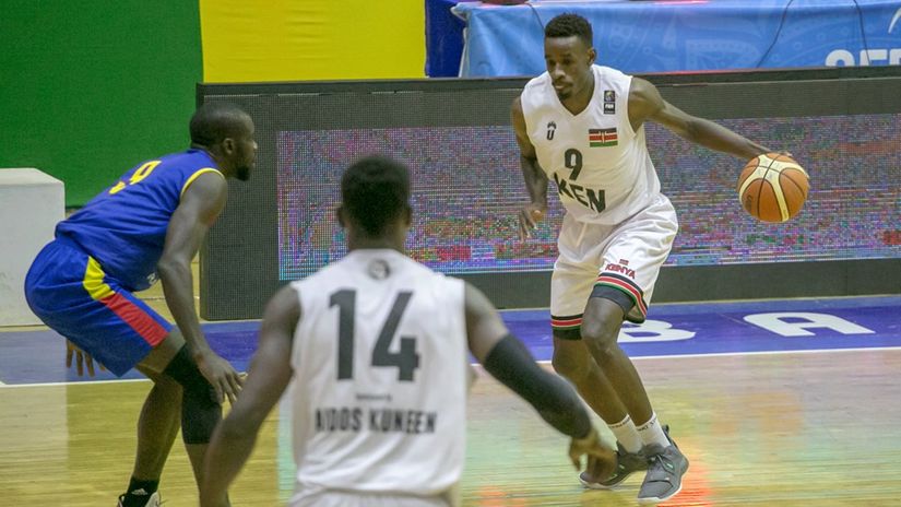 Tylor Ongwae (with ball) in action for Morans 