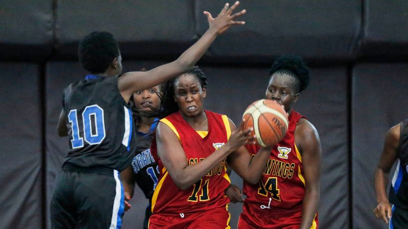 Neema Achieng (L) of Strathmore University contest for ball with Silalei Shani (C) and Lucy Machuma of Eagle Wings during their women’s Basketball Premier League match at Nyayo National Stadium Gymnasium on June 01, 2019