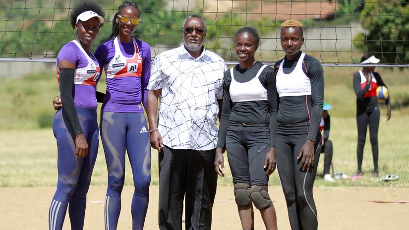 Kenya volleyball federation chairman Waithaka Kioni pose for a photo with players during their Women's Kenya Beach Volleyball Circuit match at Strathmore University on January 03, 2019.
