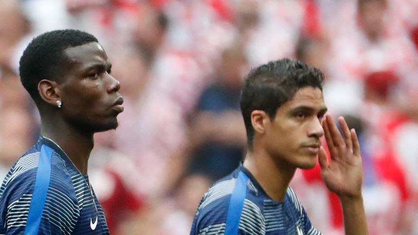 Paul Pogba & Raphael Varane (©AFP)