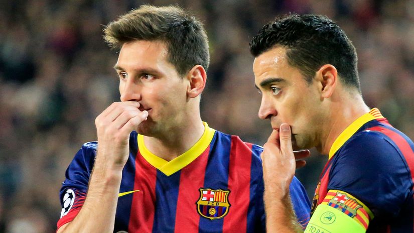 Lionel Messi and Xavi Hernandez (©AFP)