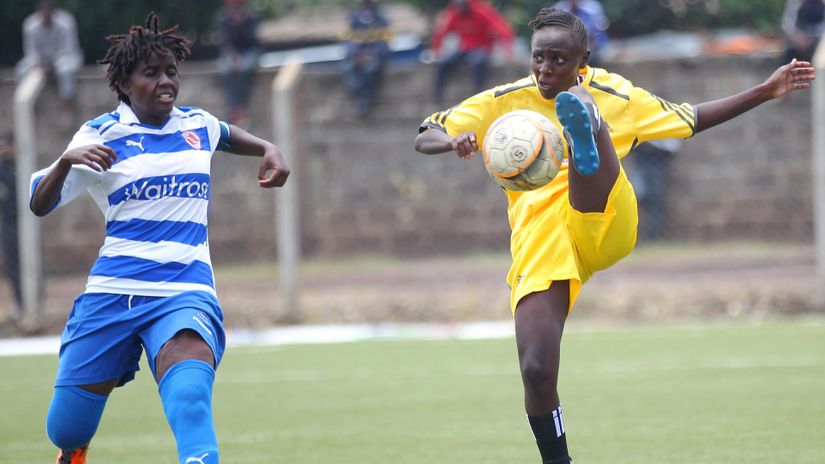 Naomi Njeri (L) of Makolanders FC challenge Enez Manango of Vihiga Queens FC during their Kenyan Women Premier League (KWPL) league match at Camp Toyoyo stadium Jericho in Nairobi on March 03, 2018