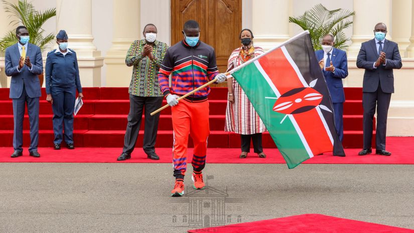 Andrew Amonde receives the flag for the President© StateHouse