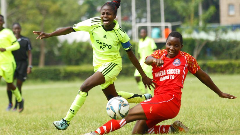 Gapos's Sheryl Angachi (L) is challenged by Kibera's Cynthia Khavaya during their Women Premier League match at Stima Club Nairobi on May 23,2021.