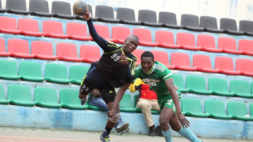General Service Unit's Philip Odije (L) defends against Inspired's Collins Simiyu during the Kenya Handball league at Nyayo National Stadium on July 18, 2021