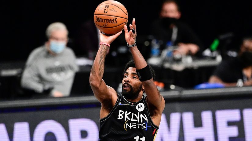 Kyrie Irving in action for Brooklyn Nets (© Steven Ryan/Getty Images)