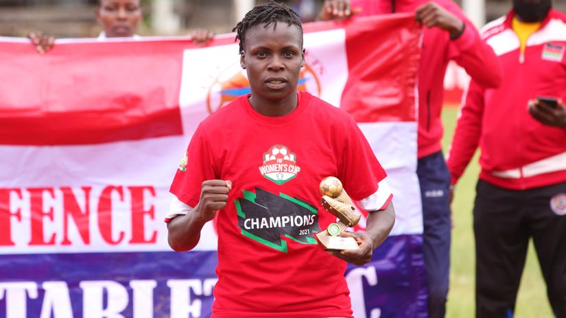 Neddy Atieno displays her golden boot award after the FKF Women's Cup victory