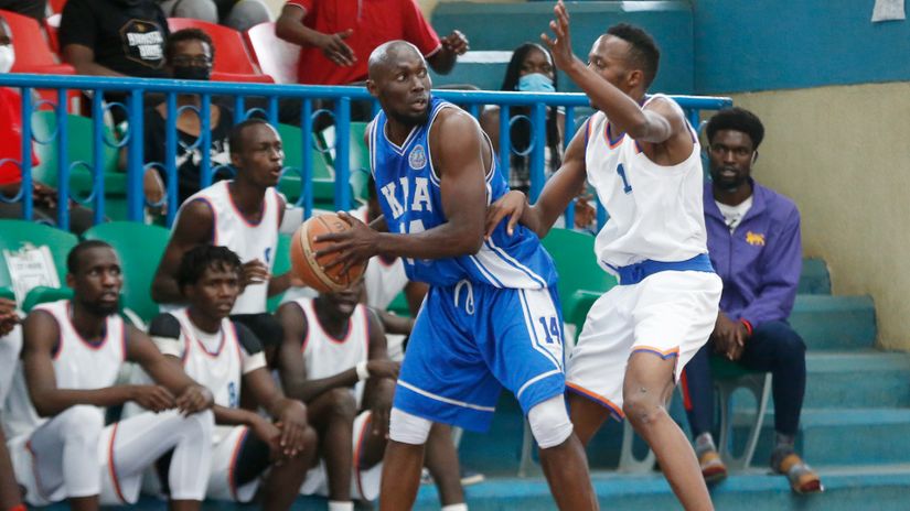 Job Byron of KPA shields the ball from Simon Wambua of KU Pitrates 