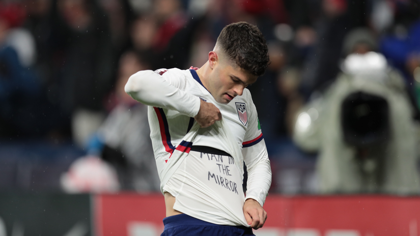 Pulisic celebrates a goal by showing 'The Man in the mirror' message underneath (©John Dorton/ISI Photos/Getty Images)