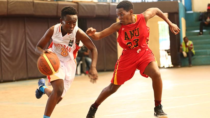 Equity Bank's Hildah Ndengwa (L) is challenged by Africa Nazarene University's Lyne Saliamo 