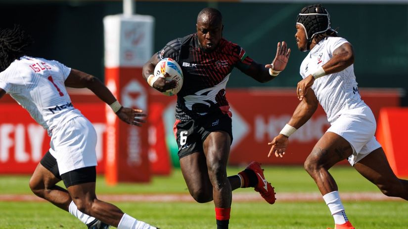 Jeff Oluoch fends off markers against USA in a previous match © Dubai Sevens