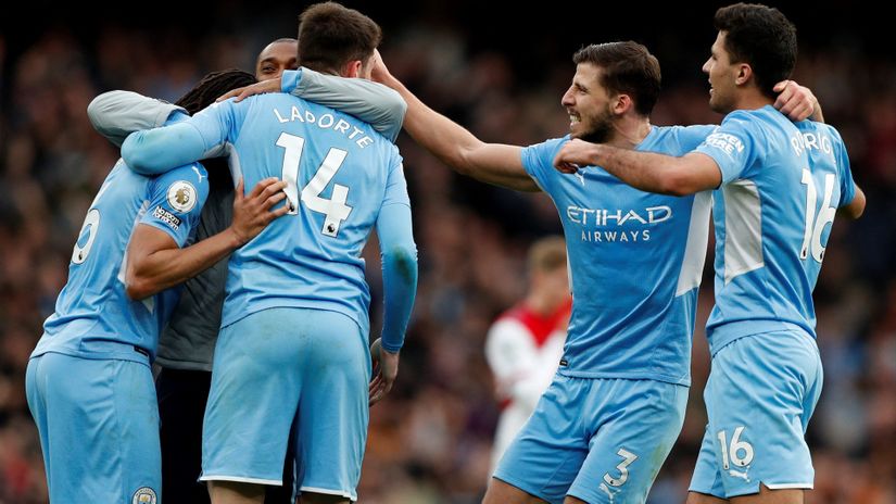 Man City players celebrate (©AFP)