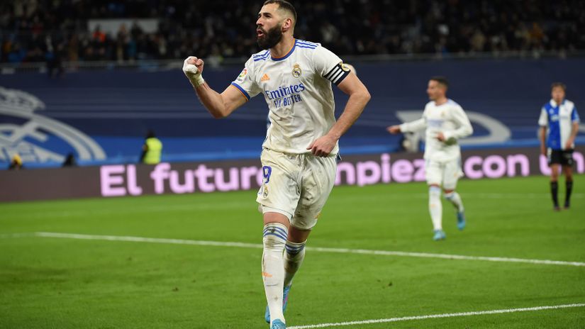 Karim Benzema celebrates after scoring the third (© Denis Doyle/Getty Images)