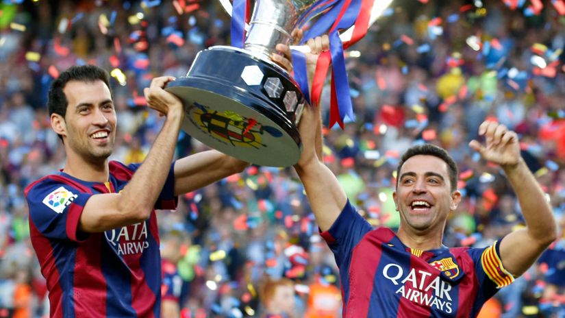 Natural born winners Sergio Busquets and Xavi Hernandez (©AFP)