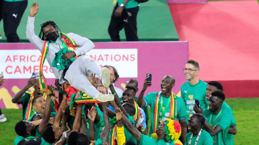 Aliou Cisse thrown in the air in celebration after the AFCON glory back in February (©Gallo Images)