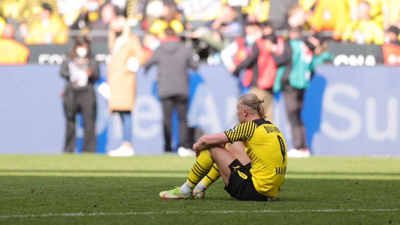 Disappointed Haaland sits on the ground after the final whistle (©Joosep Martinson/Getty Images)