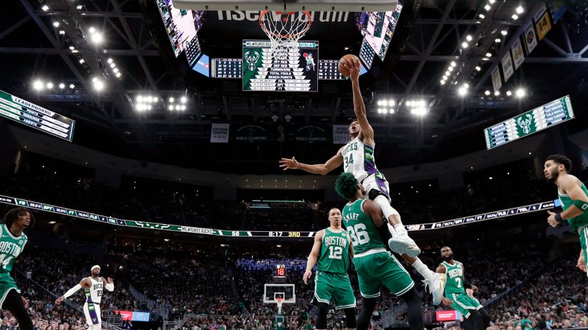 Giannis Antetokounmpo  toppling his defenders (©Gallo Images)