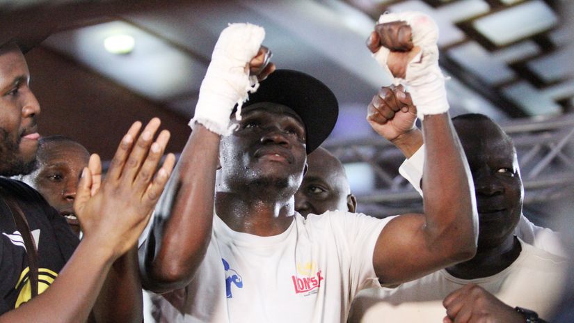 Kenyan boxer Rayton Okwiri celebrates winning the vacant Africa Boxing Union middleweight title belt against Tanzania Hussein Itaba©️ Mozzart Sport