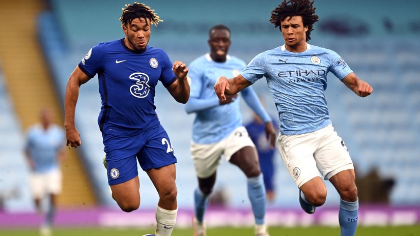 Ake fights for the ball with Reece James of Chelsea (©Shaun Botterill/Getty Images))