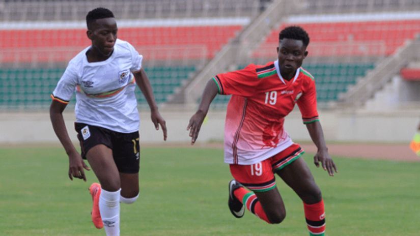 Makungu (left) takes on Ugandan Bira Nadunga during the FIFA U20 World Cup Qualifiers at Nyayo Stadium © People Daily