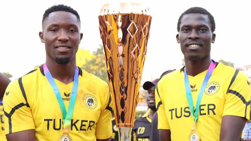 Ibrahim Joshua and Kalos Kirenge hoisting the league title © Tusker