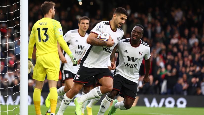 Mitro carries the ball after scoring from the spot (©Clive Rose/Getty Images)