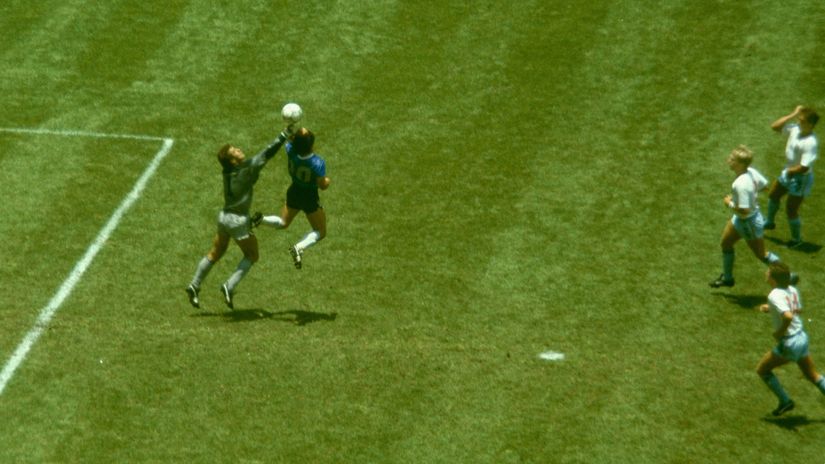 Maradona outjumps England goalkeeper Peter Shilton to score with his 'Hand of God' (©Allsport/Getty Images)