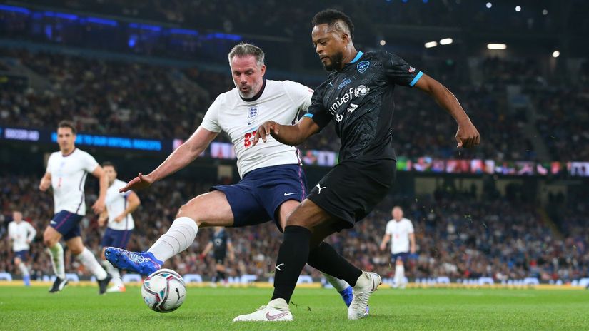 Carragher playing against Evra in a charitty match (©Alex Livesey/Getty Images)