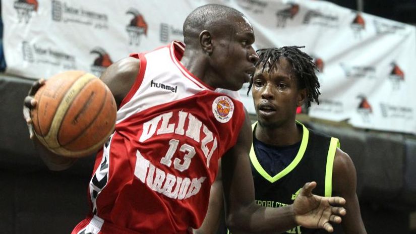 John Washika dribbles past Faheem Juma in past action © Mozzart Sport 