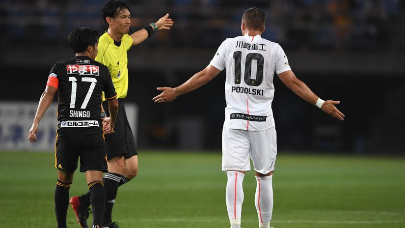 Podolski having a chatt with the referee a few years ago (©Etsuo Hara/Getty Images)