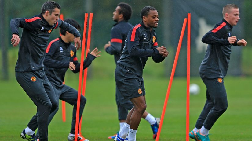 Van Persie and Evra at the Man Utd practice (© Richard Heathcote/Getty Images)