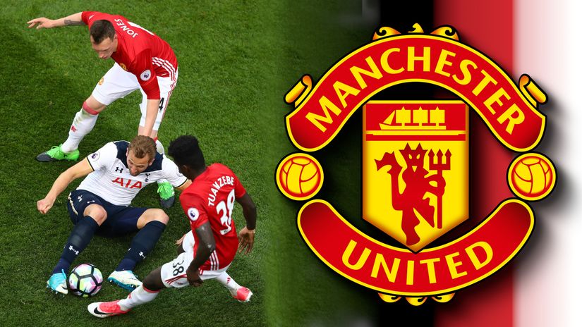 Phil Jones and Axel Tuanzebe trying to stop Harry Kane (©Getty Images)