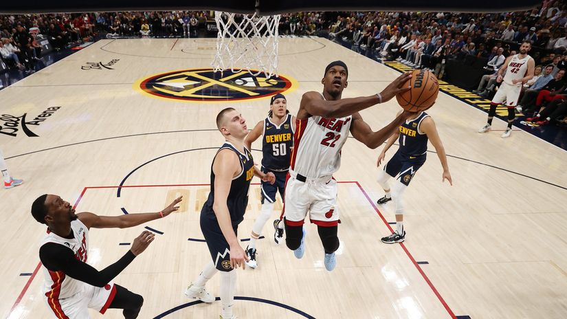 Butler goes past Jokic to score (©Matthew Stockman/Getty Images)