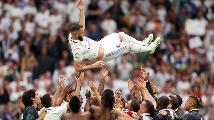 Benzema is thrown in the air by teammates following his last game for the Royals (©Florencia Tan Jun/Getty Images)