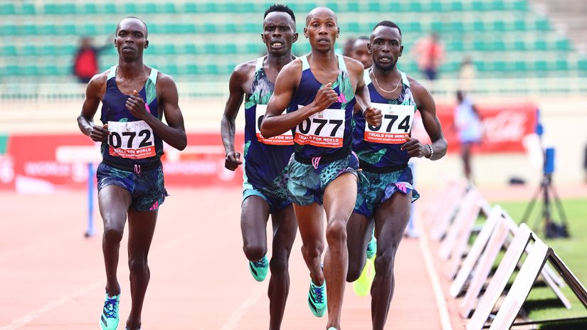 Simon Koech (077) leads 3000m steeplechase competitors during AK trials © Mozzart Sport 