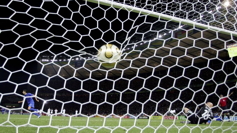 Grosso takes the matchwinning penalty, as Fabien Barthez dives the wrong way (©Michael Steele/Getty Images)