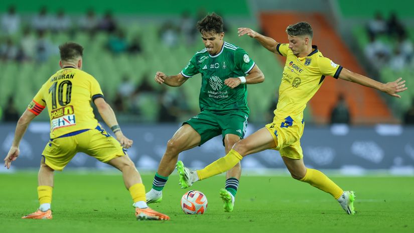 Veiga (green shirt) in action for Al-Ahli in Saudi Pro League (©Yasser Bakhsh/Getty Images)