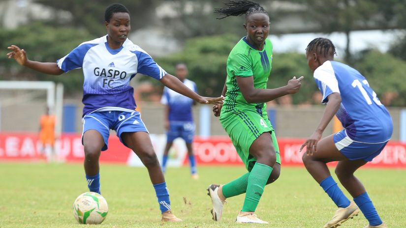 Adrine Birungi (L) and Leah Andiema (R) of Gaspo FC tackle Phelistus Kadari of Vihiga Queens FC © Mozzart Sport 