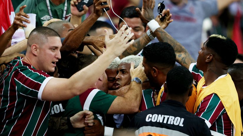Kennedy celebrates with the fans after scoring the winner. He was sent off for that (©Getty images sport)