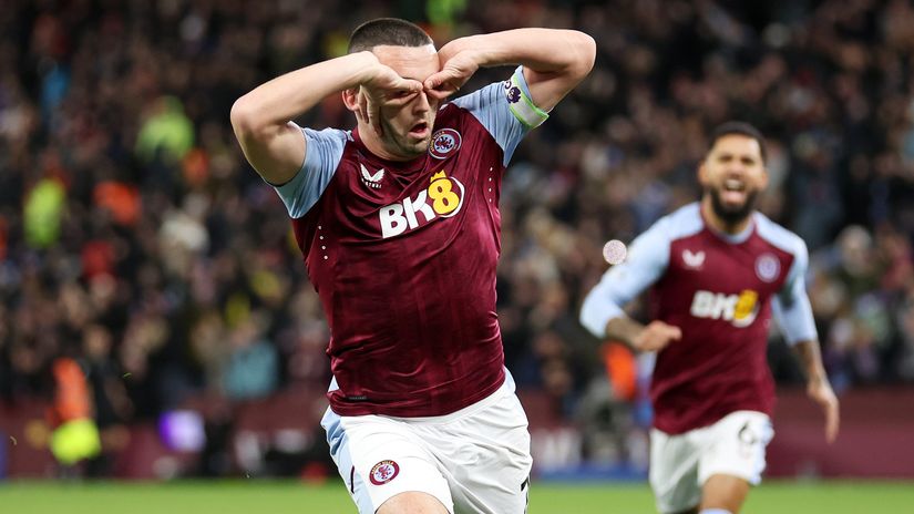 McGinn celebrates after scoring against Arsenal (©Catherine Ivill/Getty Images) 