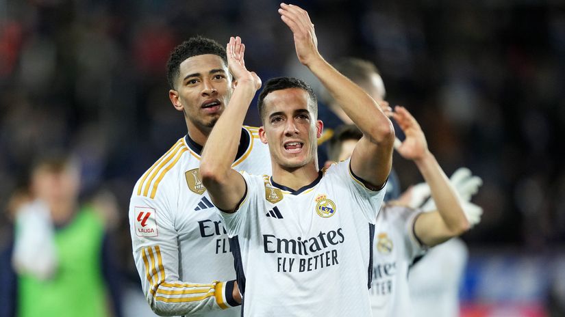 Lucas Vazquez celebrates with Bellingham after the game (©Juan Manuel Serrano Arce/Getty Images)